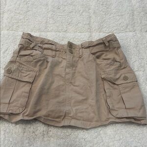 Brandy Melville light tan cargo skirt with side pockets and adjustable side tabs